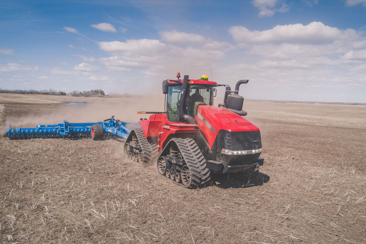 Case IH Quadtrac tractor working a field, seen from above