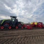 ValveMaster-Bridge on a Claas Xerion 12.650 pulling a Grimme potato planter in the field