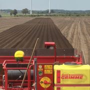 John Deere StarFire receiver mounted on a Grimme planter for implement guidance